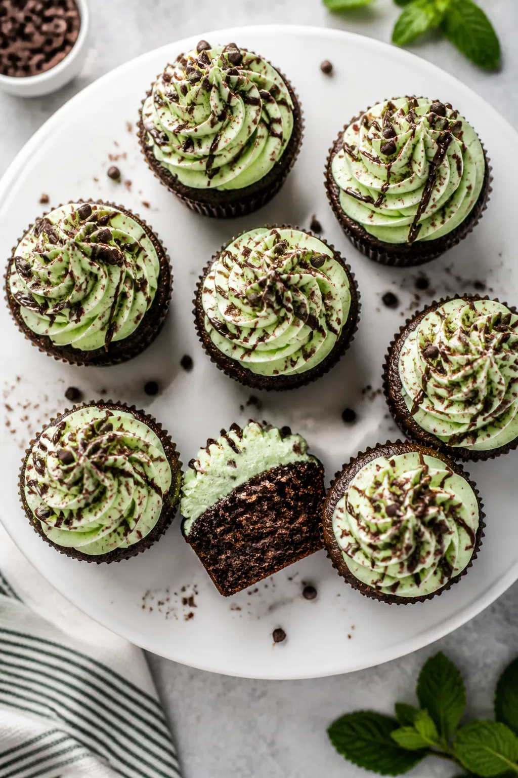 Final dish, tasty top view: Overhead shot of mint chocolate cupcakes fully baked and cooled, topped
