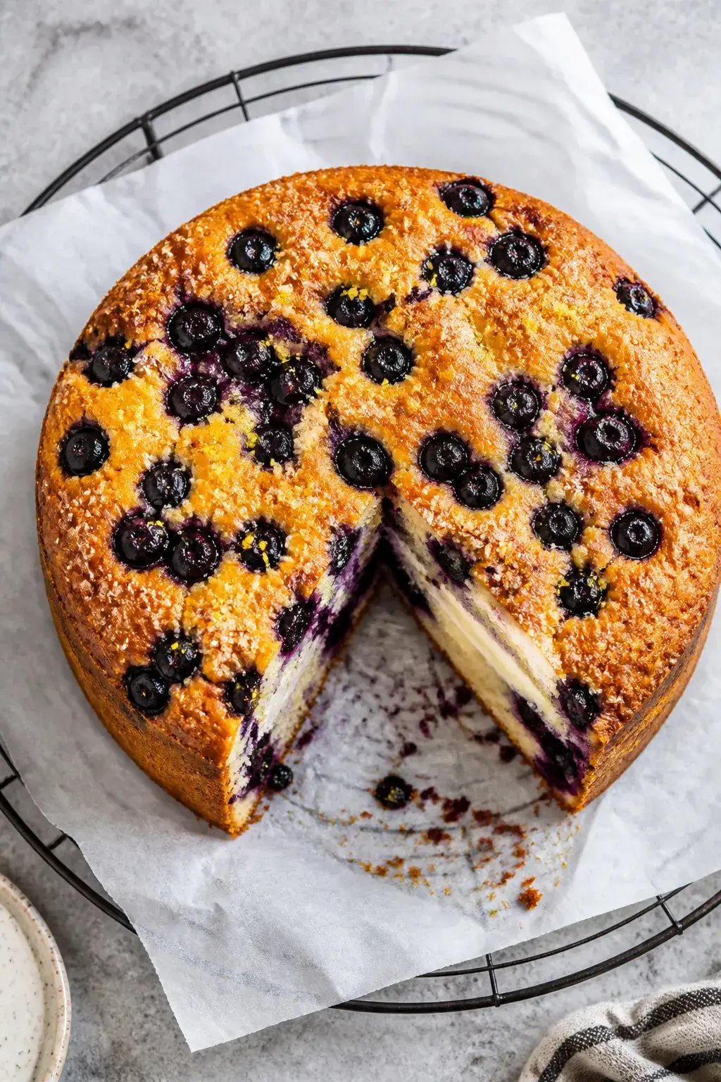 Overhead shot of the baked Blueberry Cream Cheese Muffin Cake just out of a 9-inch springform pan, t
