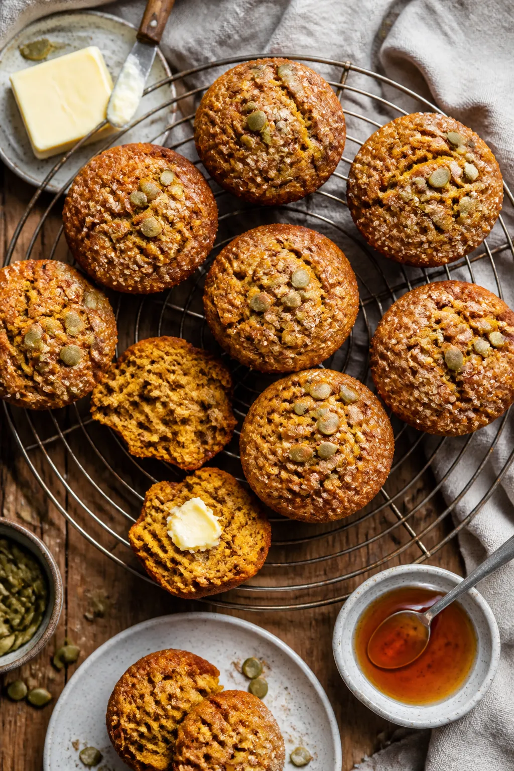 Tasty top view final presentation: Overhead shot of freshly baked vegan pumpkin muffins on a cooling